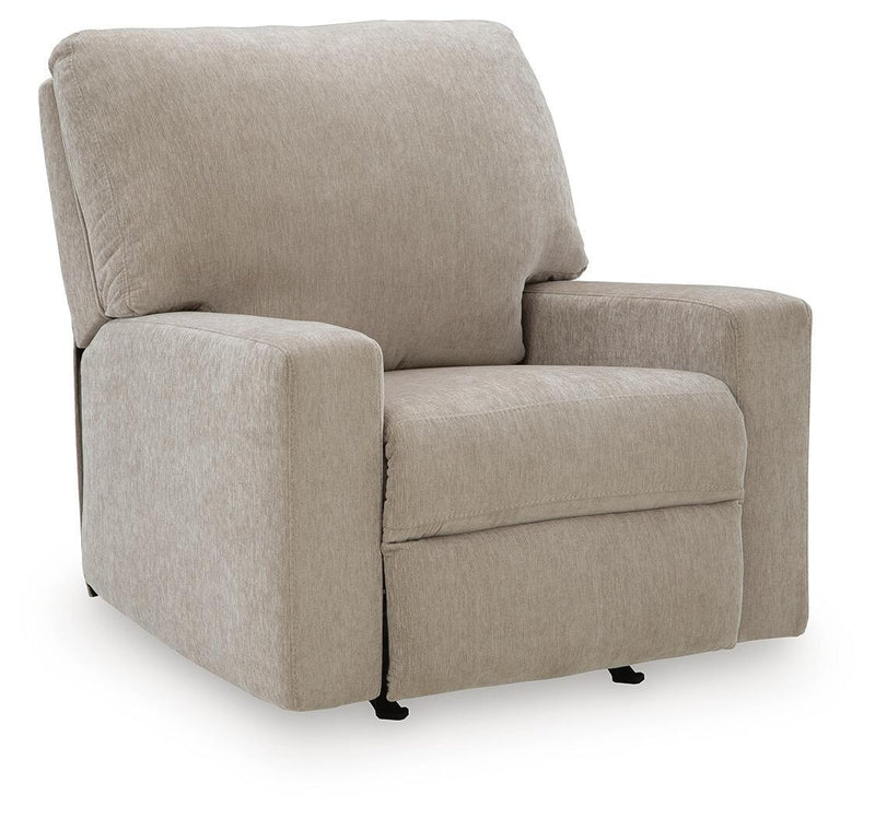 Beige fabric rocker recliner with padded arms and smooth cushioned seat.