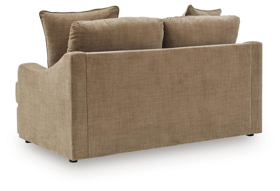 Beige upholstered loveseat with wide arms and back cushions