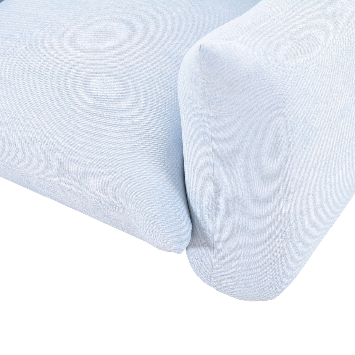 Light blue outdoor armchair close-up of upholstered armrest and side cushion edge