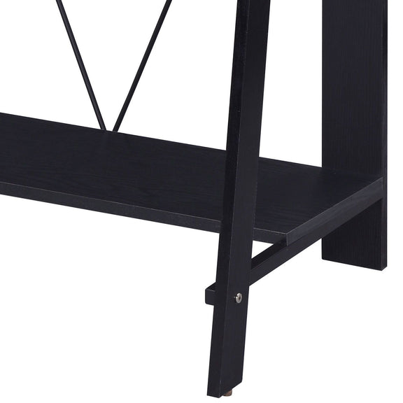 Dark writing desk corner with lower shelf and X-brace frame, with foot detail
