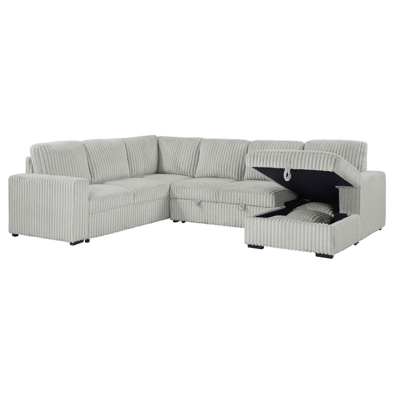 Light gray sectional with pop-up bed storage; open bed compartment reveals mattress