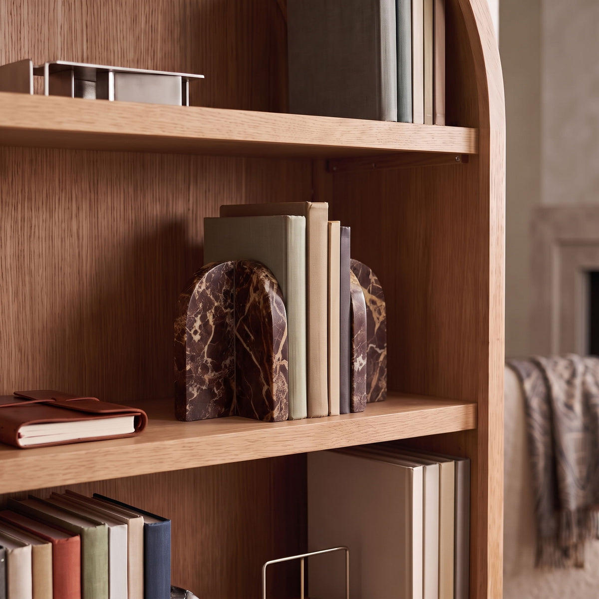Genuine marble bookends in dark red and brown with marbled veining.