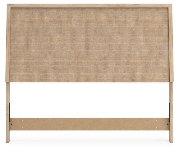 Beige woven panel headboard with light wood frame and bottom support rail