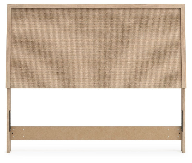 Beige woven panel headboard with light wood frame and bottom support rail