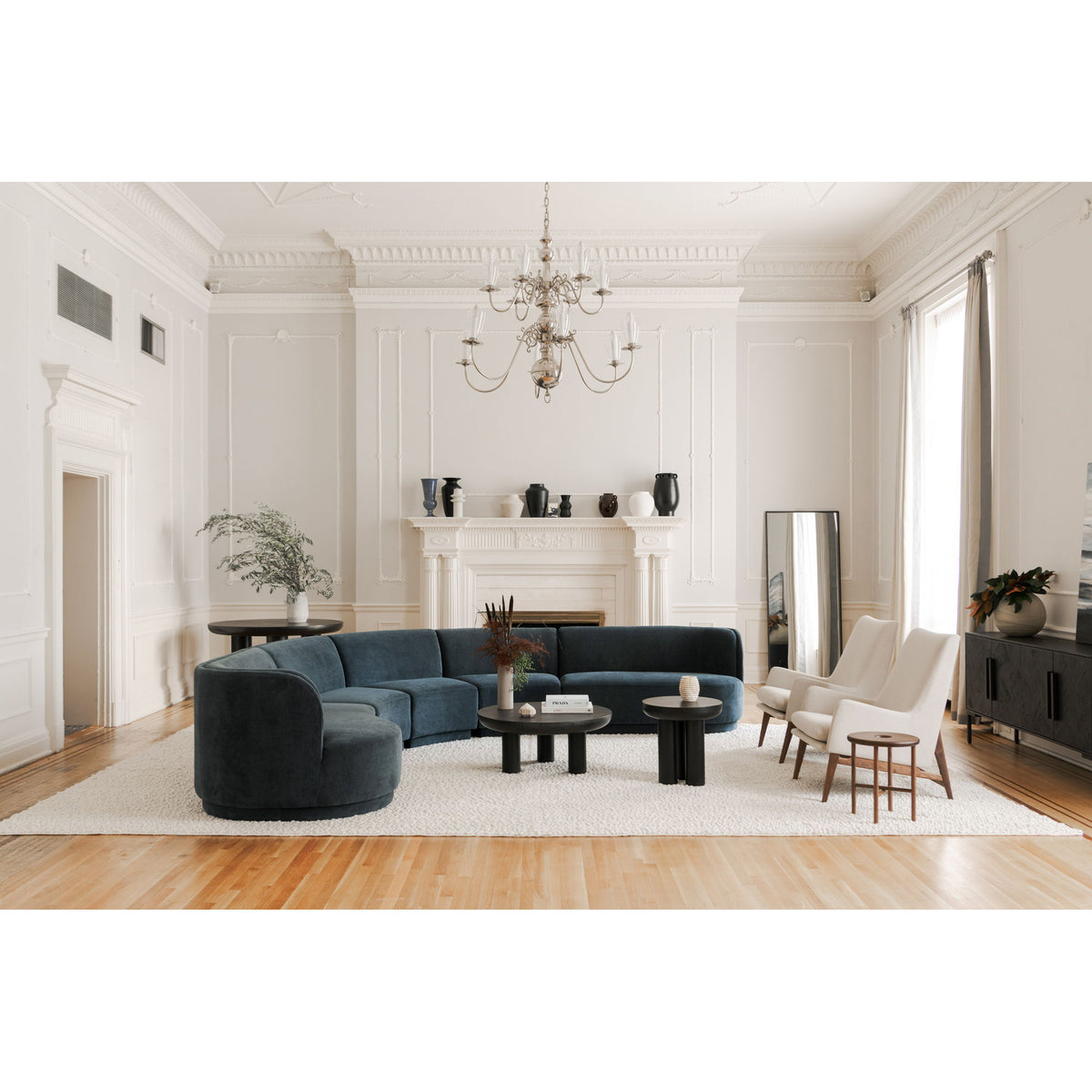 Round black cement coffee table centerpiece with pedestal base
