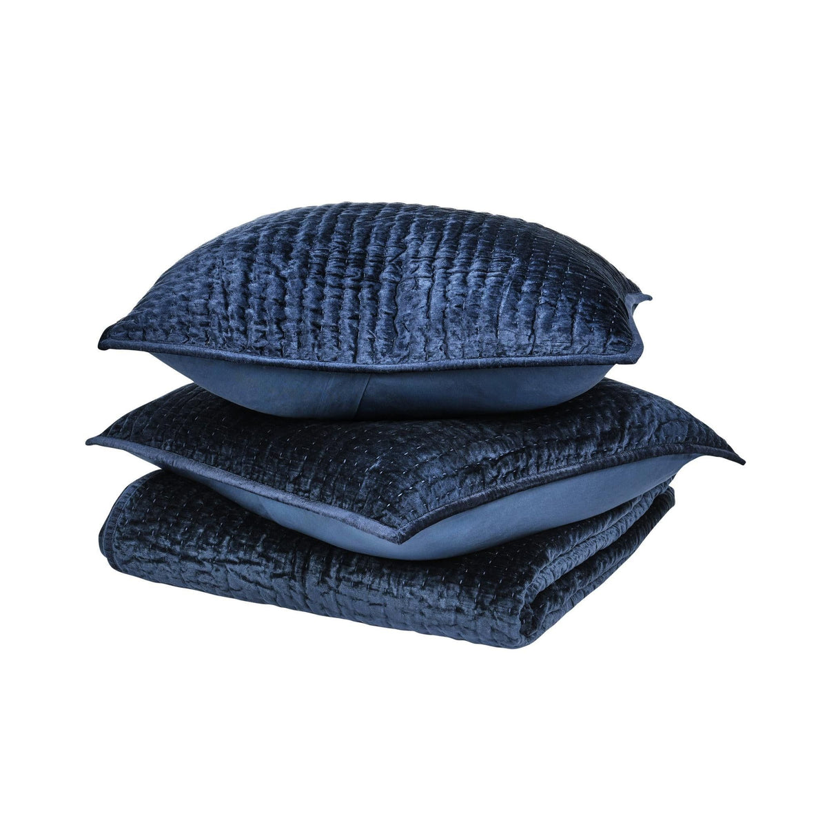 Navy velvet quilt with matching square throw pillows, stacked set