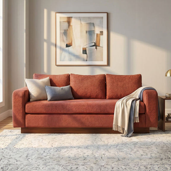 Terracotta red 3-seater sofa with rounded arms and boxy seat cushions