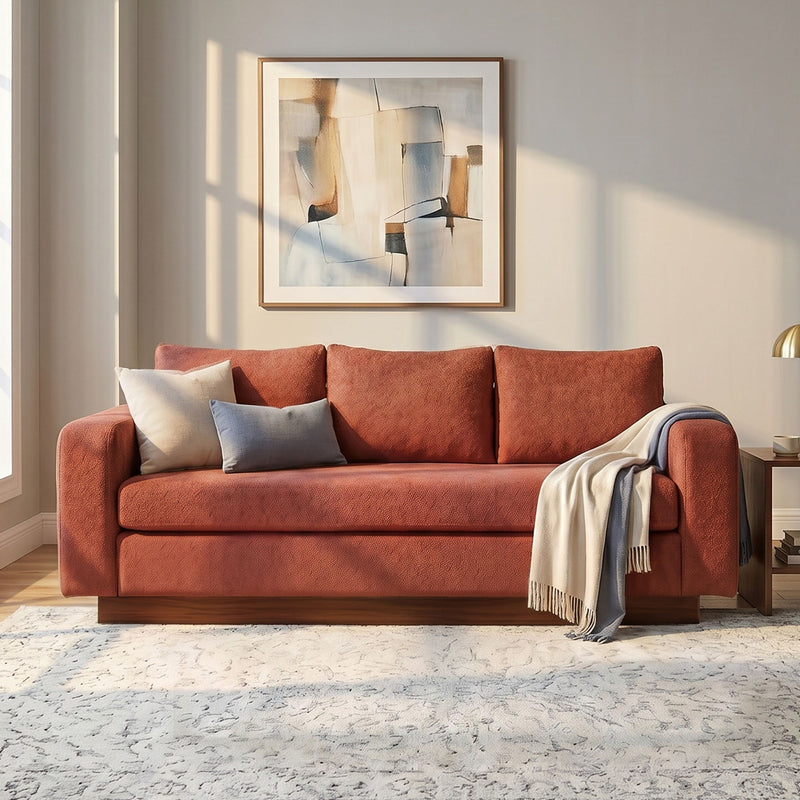 Terracotta red 3-seater sofa with rounded arms and boxy seat cushions