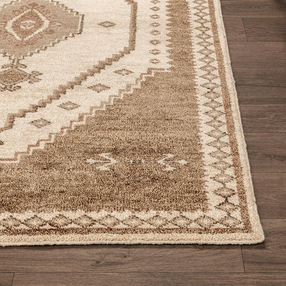 Luxor hand-knotted rug with cream field and desert-brown tribal pattern and border