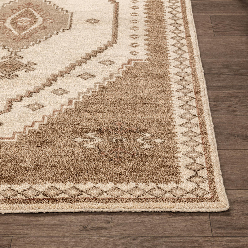 Luxor hand-knotted rug with cream field and desert-brown tribal pattern and border