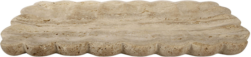 Beige travertine tray with scalloped edge and uneven speckled texture