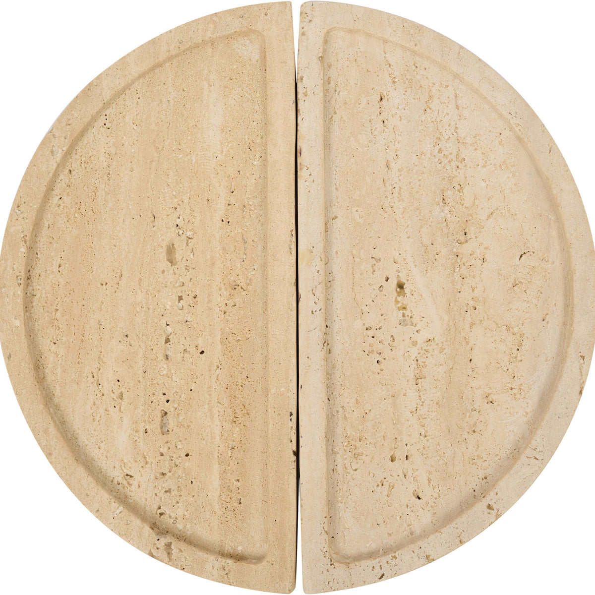 Beige travertine tray close-up with two semicircular halves and speckled texture.