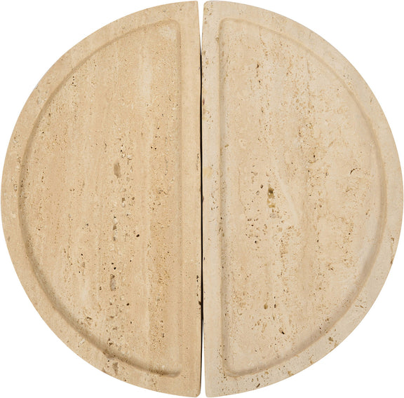 Beige travertine tray close-up with two semicircular halves and speckled texture.