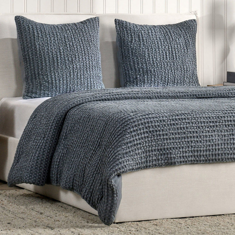 Textured marina blue square sham pillows with woven waffle pattern