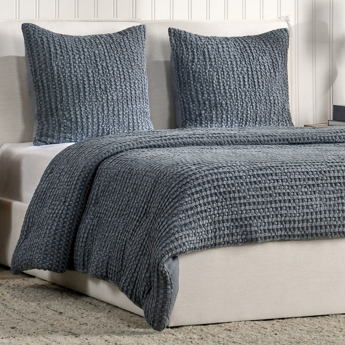 Colmar quilt set in marina blue: textured quilt and two square pillow shams, angled
