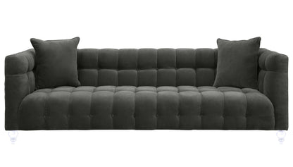Dark gray velvet sofa with tufted back cushions and two square arm pillows