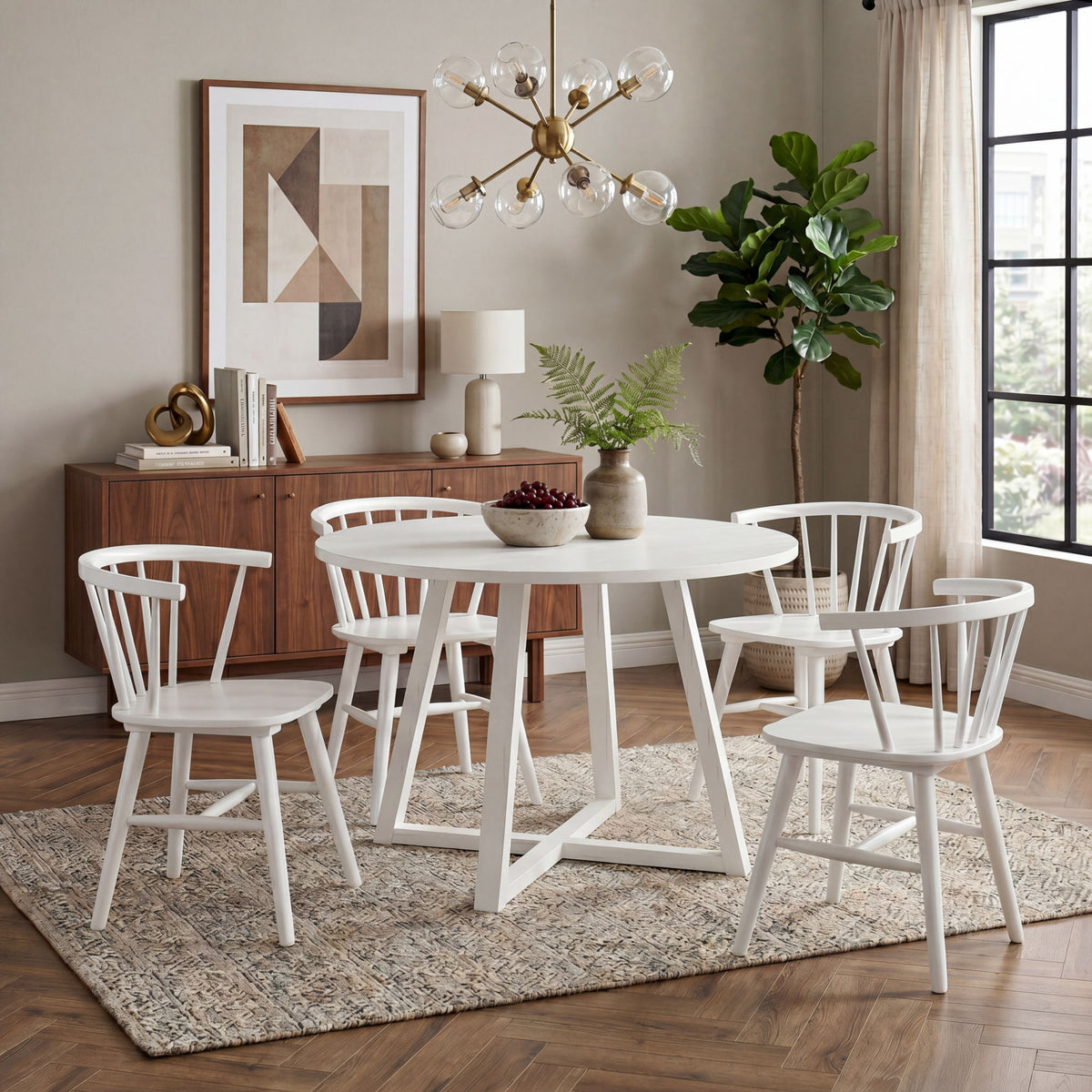 White round dining set with four spindle-back Windsor chairs and trestle base