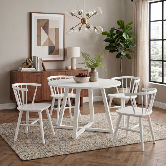 White round dining set with four spindle-back Windsor chairs and trestle base