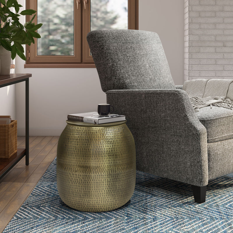 Gold-toned metal storage accent table with textured drum body and flat round lid