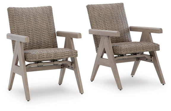 Set of 2 beige woven rocking arm chairs with light wood frames and arms