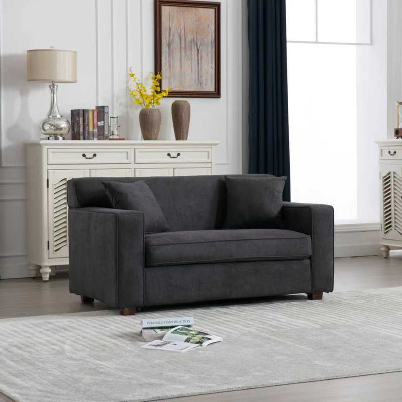 Gray 2-in-1 lounge chair with two throw pillows and cushioned armrests