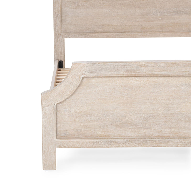 Solid wood bed footboard close-up with light wood finish and slatted panel