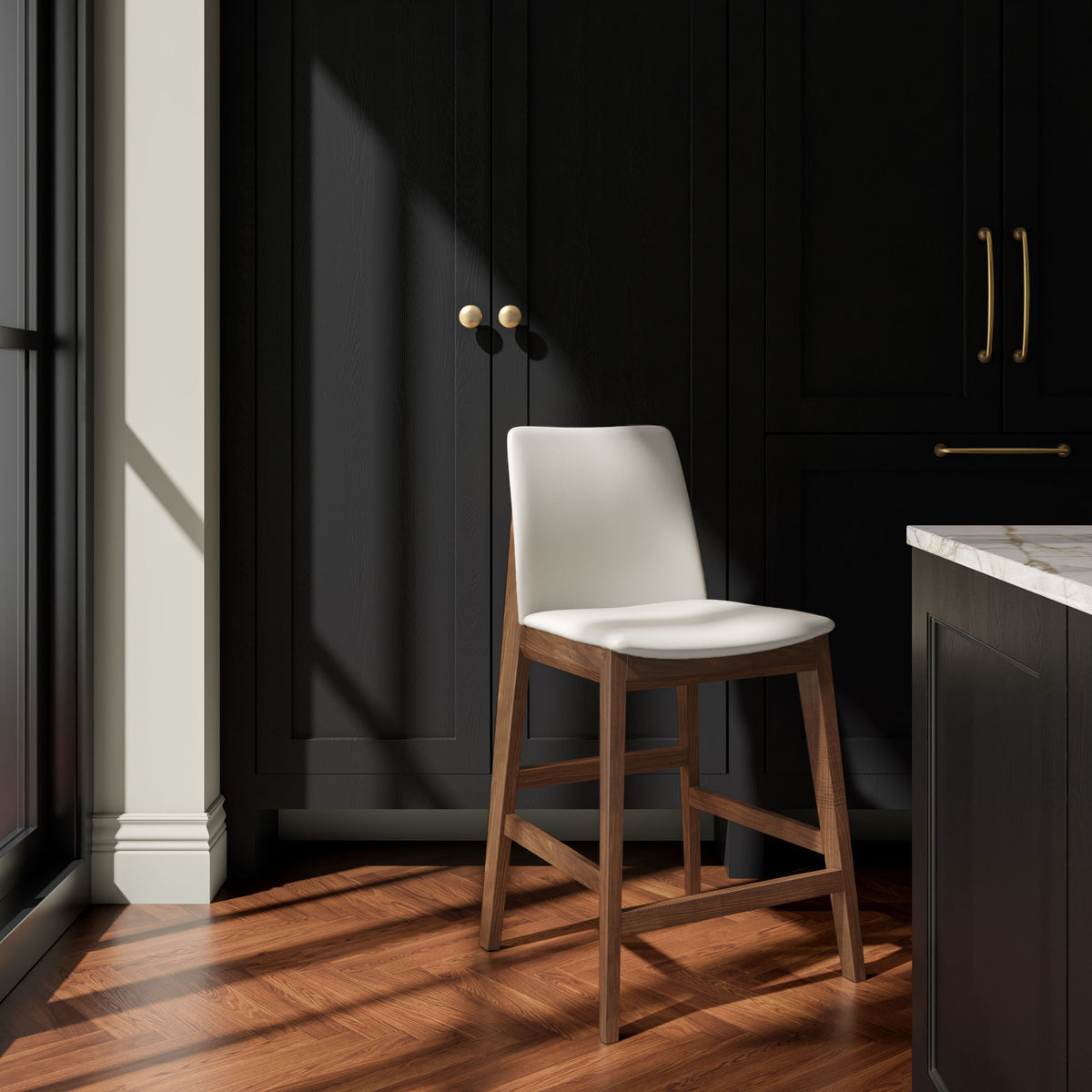 White counter stool with padded seat and back, dark wood frame, shown at an angle