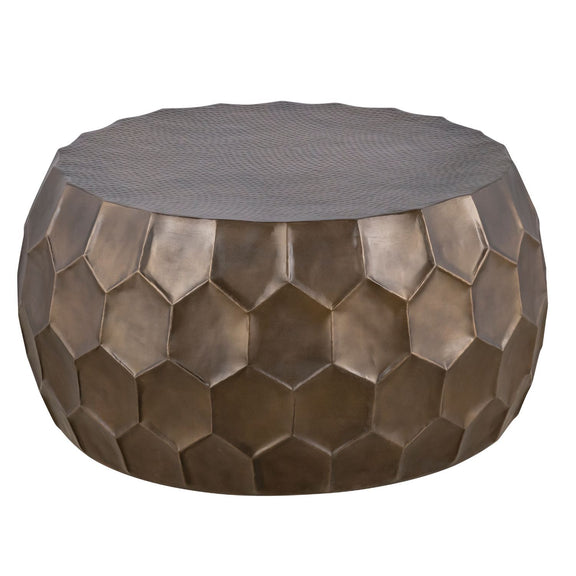 Round coffee table with bronze hex-pattern metal sides and gray fabric top