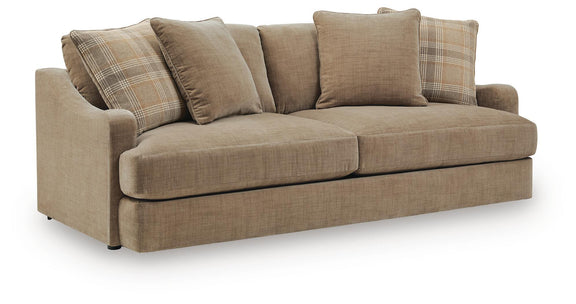 Beige fabric sofa with two solid back cushions and plaid throw pillows