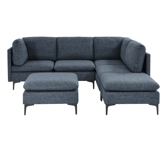 Dark gray upholstered modular sectional with ottoman and chaise extensions on tall legs