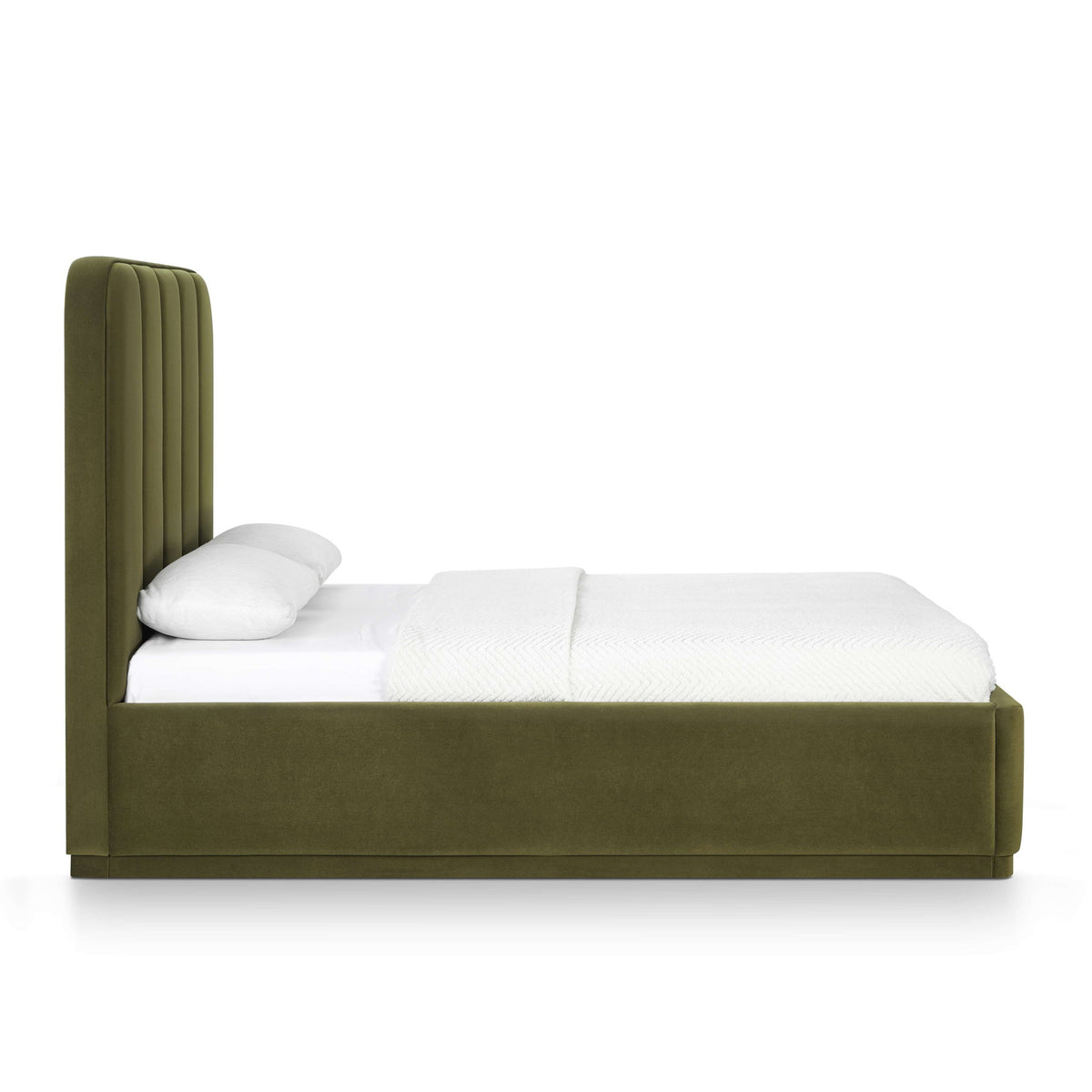 Dark green performance velvet bed with padded headboard and white bedding with pillow