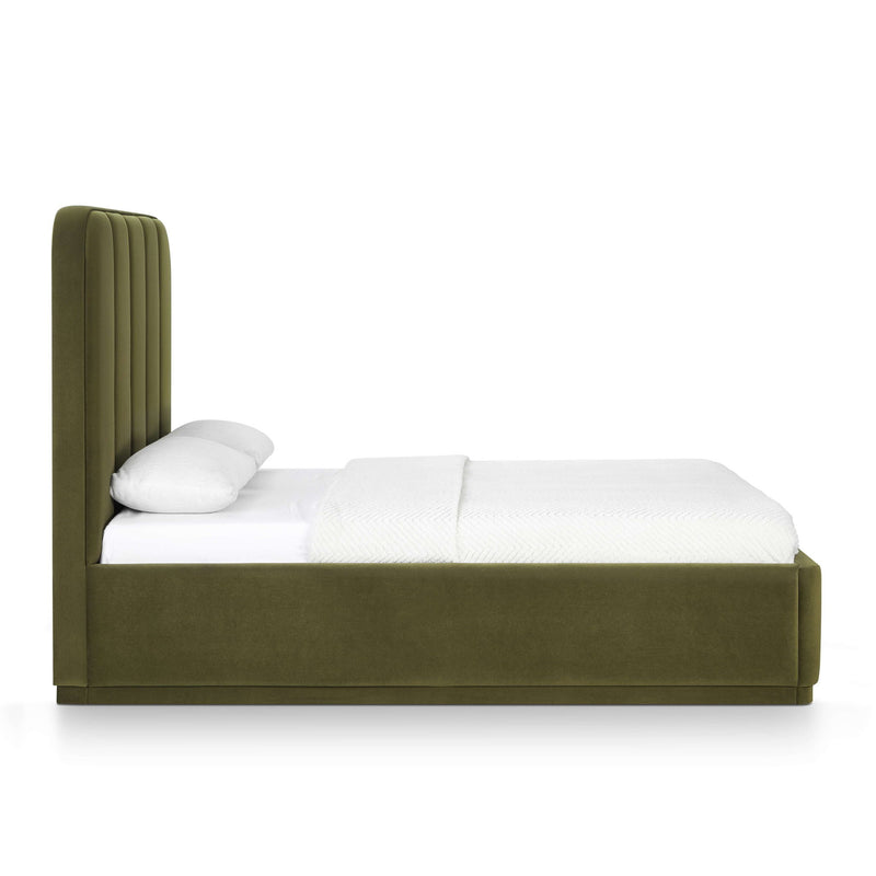 Dark green performance velvet bed with padded headboard and white bedding with pillow