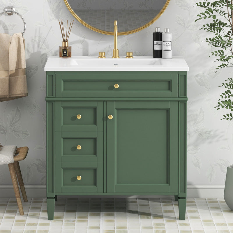 Dark green bathroom vanity with integrated sink and two drawers, gold knobs