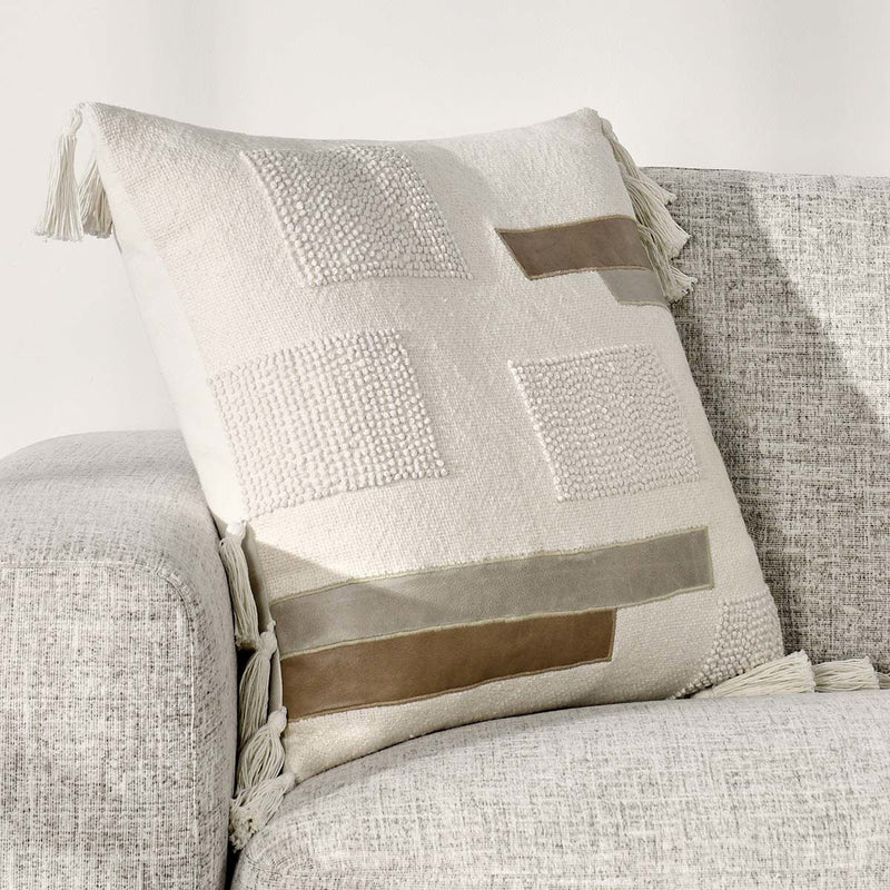 Packer ivory patchwork pillow with patterned panels and tassel accents
