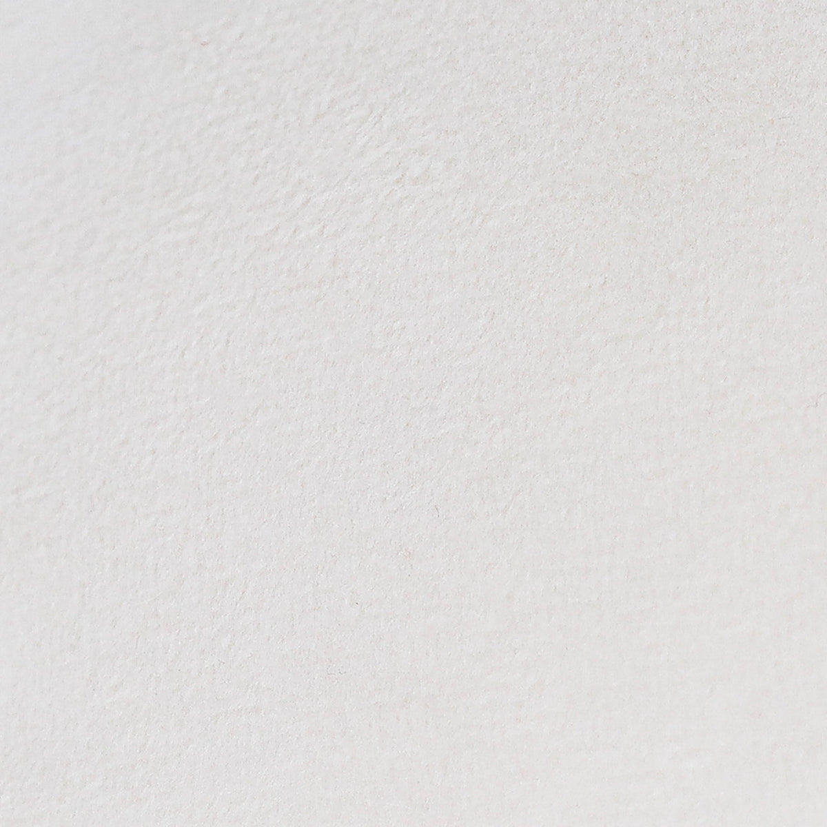 White textured pillow fabric, smooth close-up view.