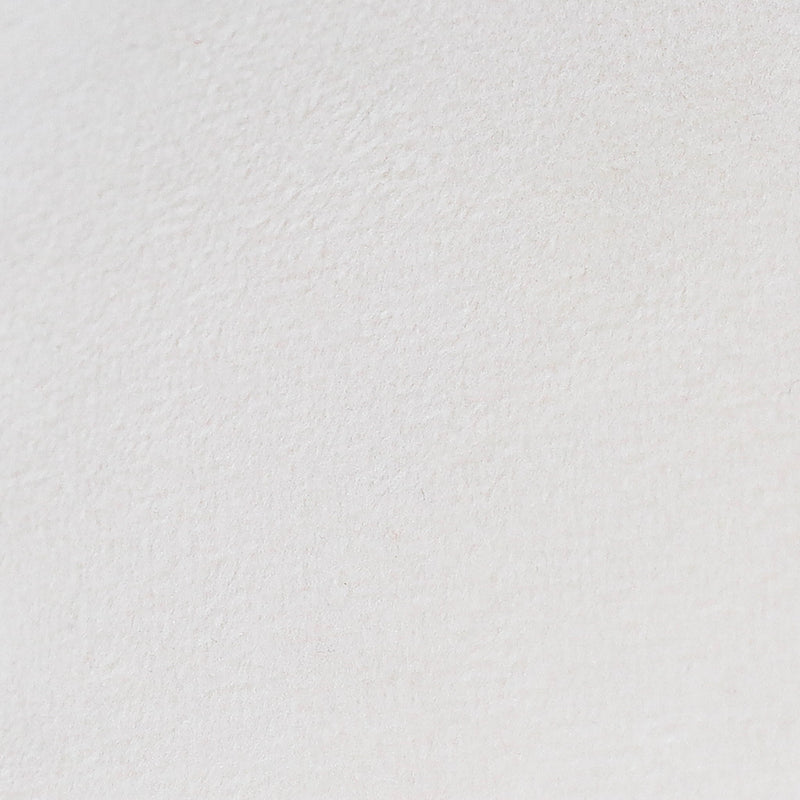 White textured pillow fabric, smooth close-up view.