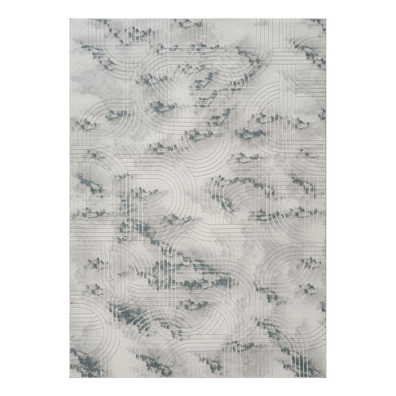 Gray area rug with geometric 3D effect and swirling line pattern.
