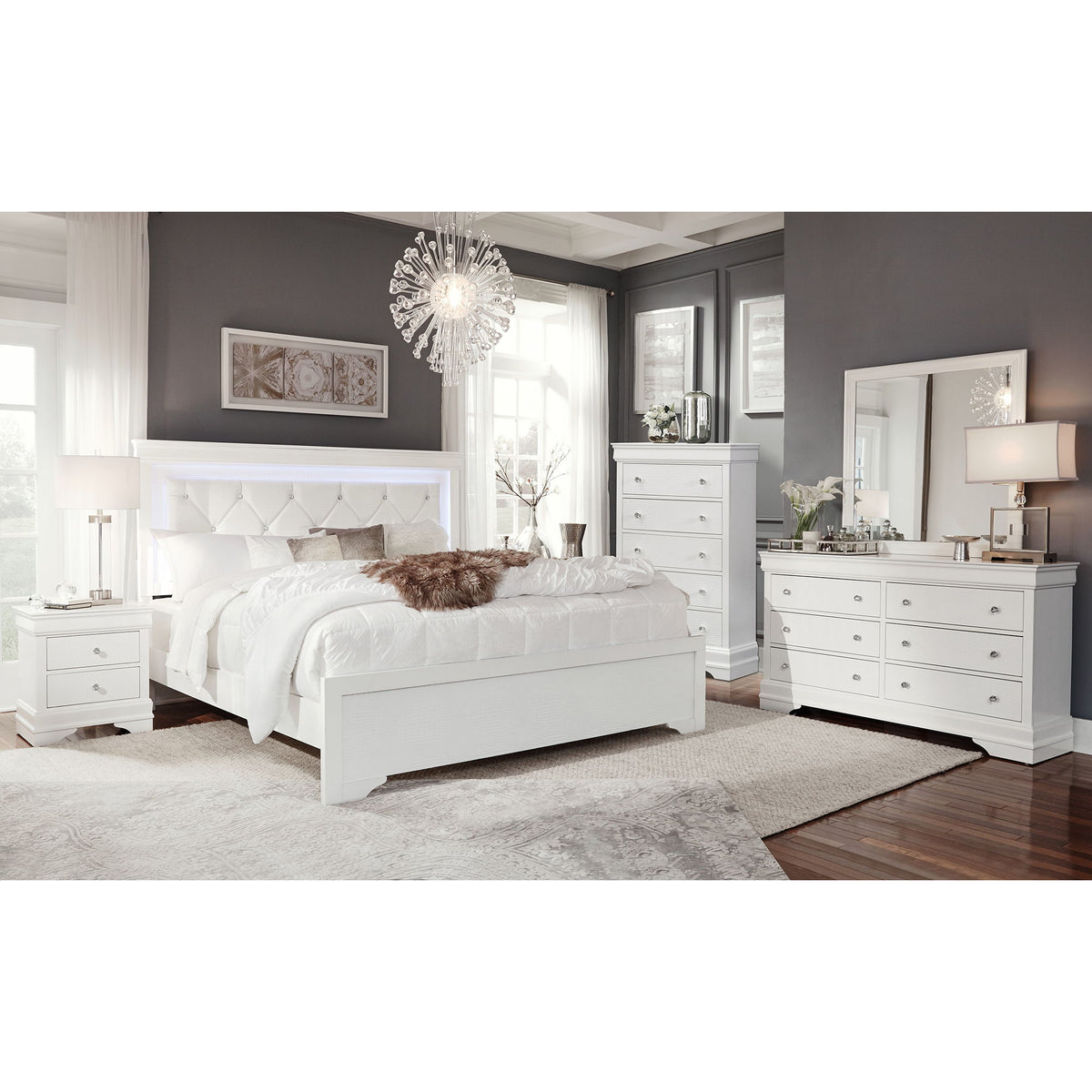 Bedroom set with white upholstered bed and matching dresser with multiple drawers