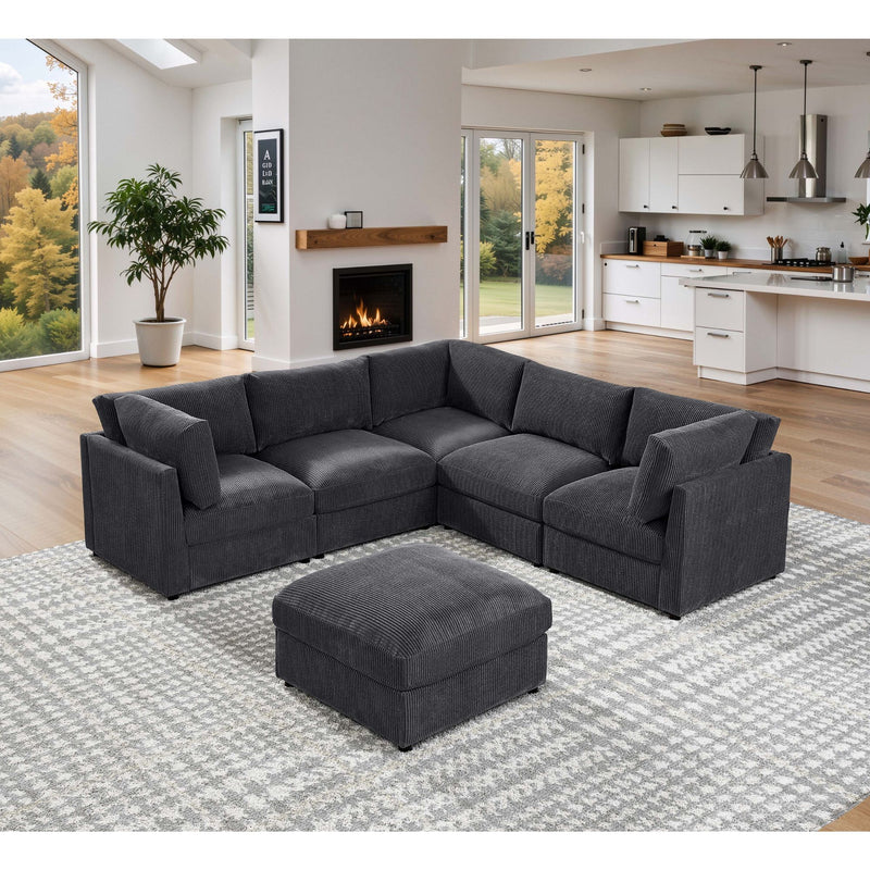 Dark gray modular sectional sofa with chaise and a matching square ottoman.