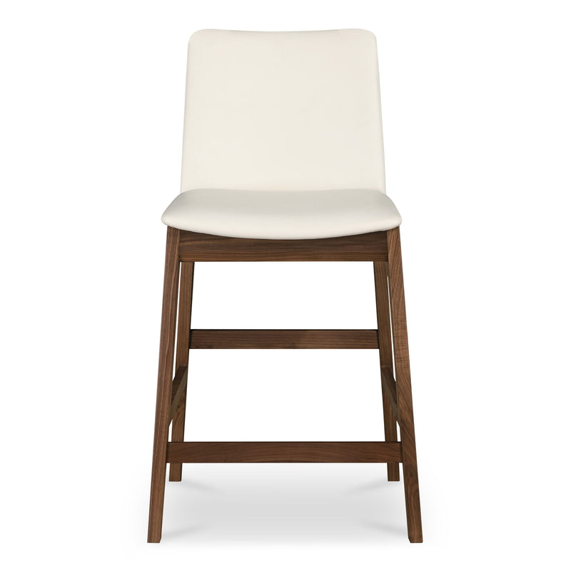 White counter stool with padded seat and back, dark wood frame, and footrests