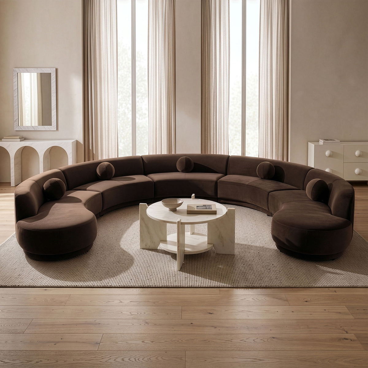 Brown velvet sectional sofa with rounded seats and curved back cushions in a room.