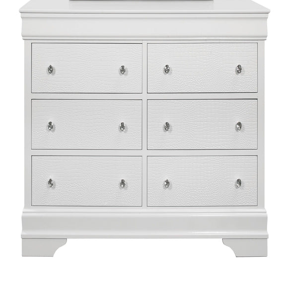 White chest of drawers with six drawer fronts and shiny metal knob pulls