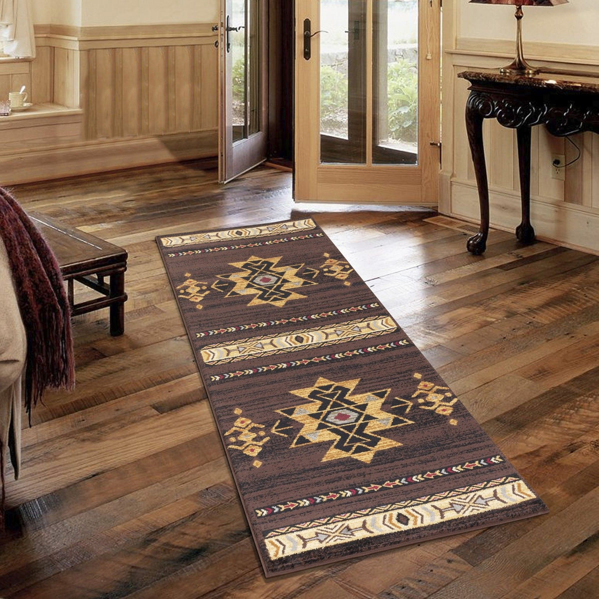 Southwest area rug runner, dark brown with gold star and diamond motifs, cream border