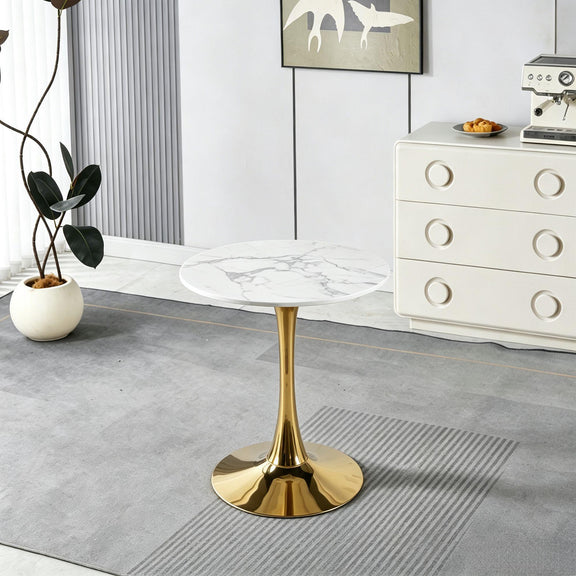 Round pedestal dining table with white marble-look top and gold pedestal base