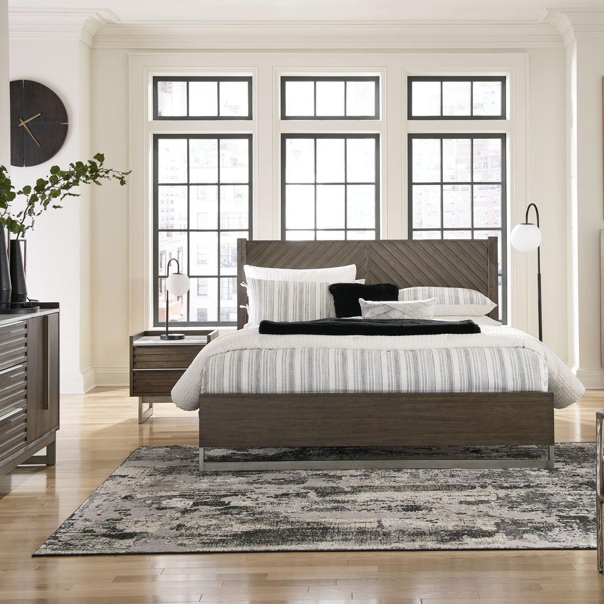 King panel bed in grayish brown wood with headboard and footboard