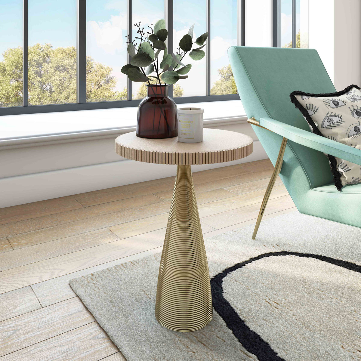 Beige round side table on ribbed gold pedestal base