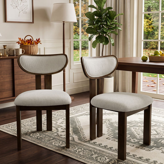 Beige upholstered dining chairs with curved backs and dark wood frames
