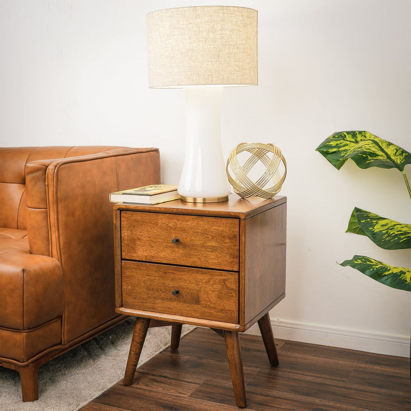 White ceramic base table lamp with beige fabric drum shade and gold stem