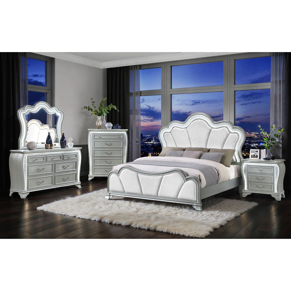 Silver upholstered bed set with matching dresser and nightstands in a bedroom setting