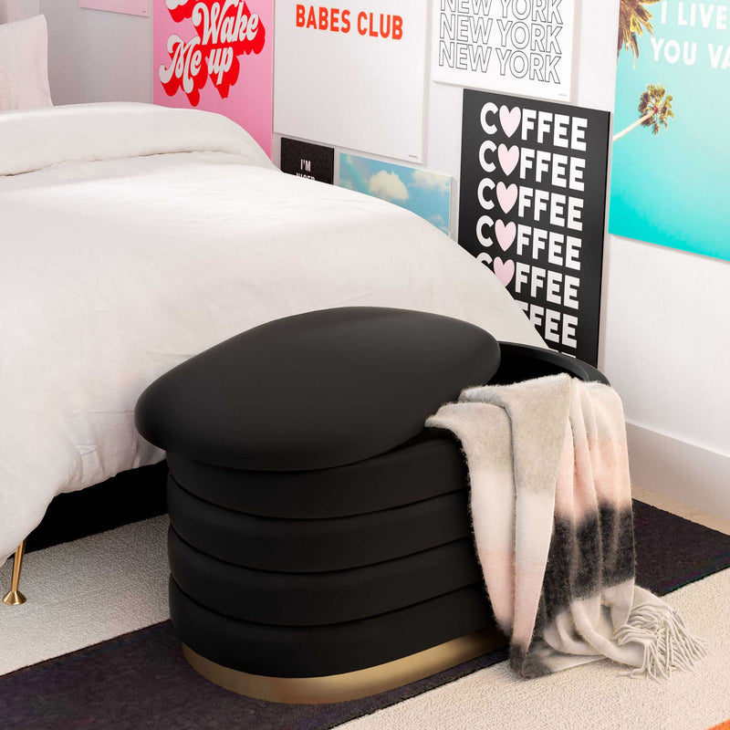 Black velvet storage bench with padded lid and gold base